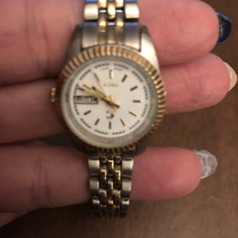 Gold and silver clasp watch